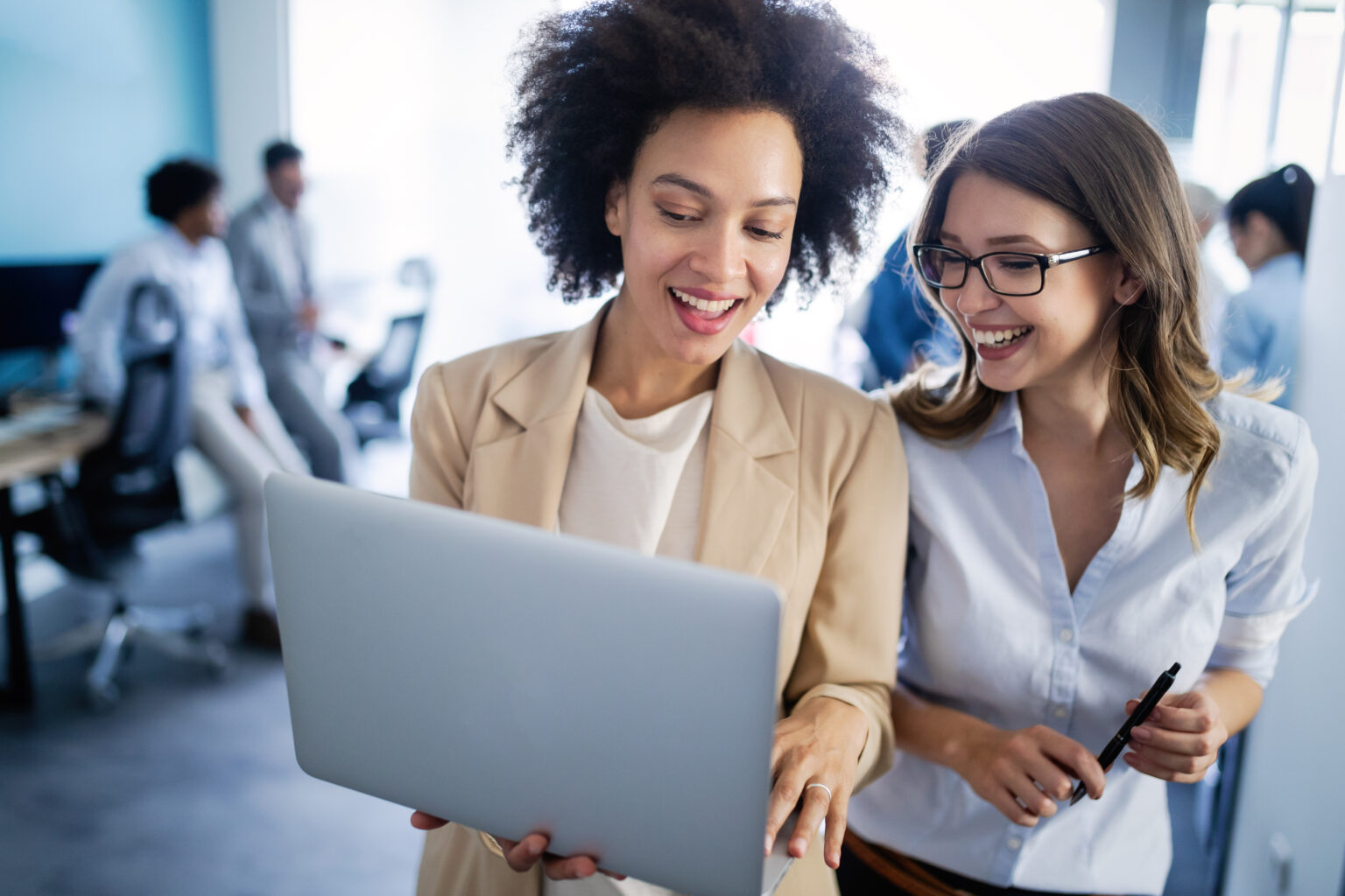 Programmers cooperating at IT company developing apps